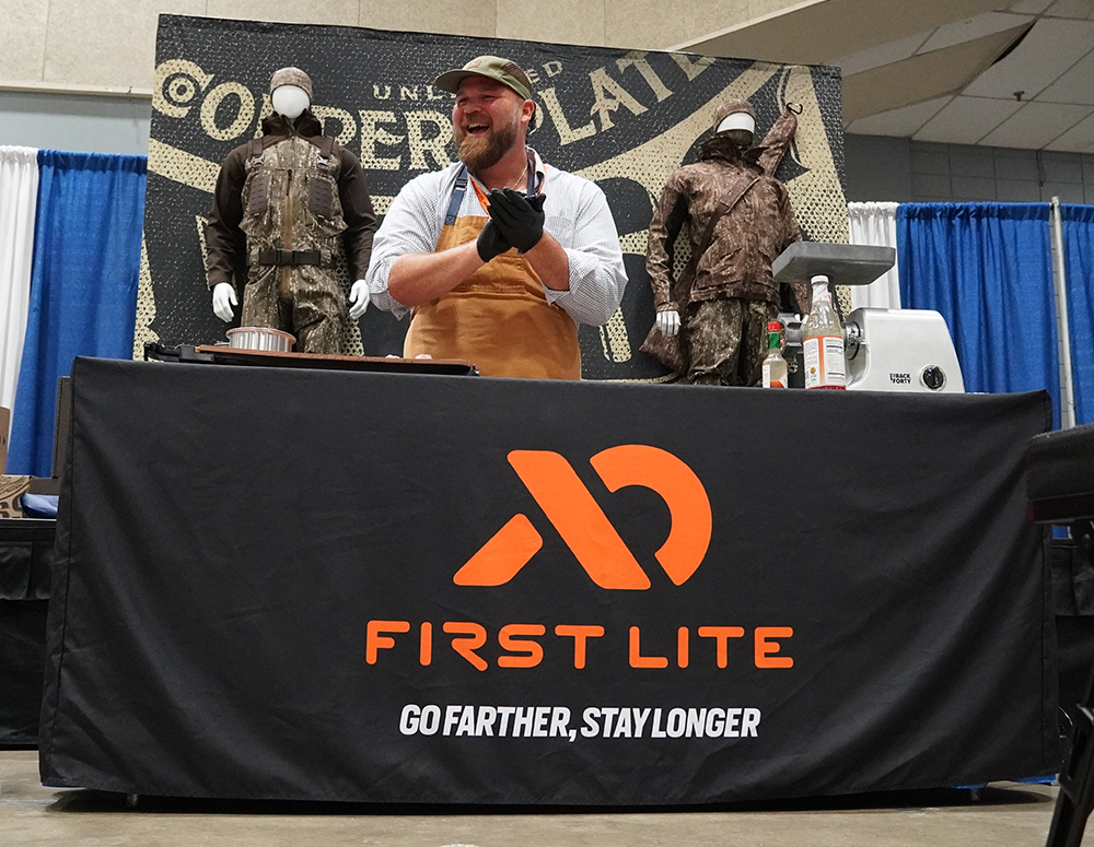 Chef Jean-Paul Bourgeois work's the stage and the grill as part of the 2023 Duck Hunters Expo.