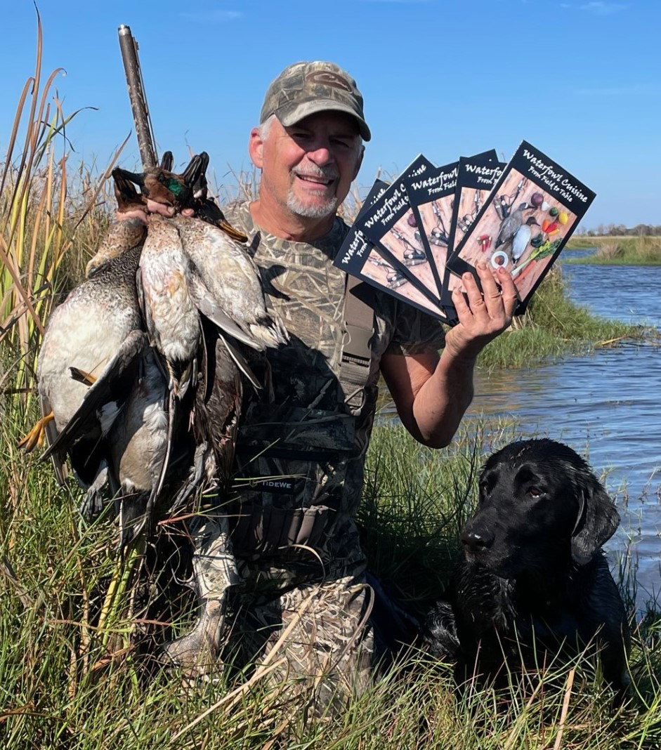Professor Mark Merchant is seen on a hunt with his catch as well as his cookbook.